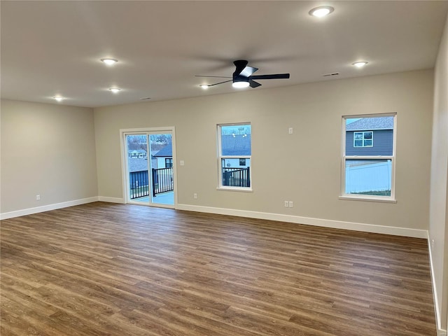 empty room featuring dark hardwood / wood-style floors and ceiling fan