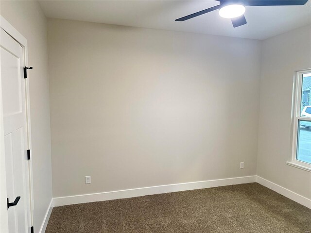 carpeted empty room with ceiling fan and a healthy amount of sunlight