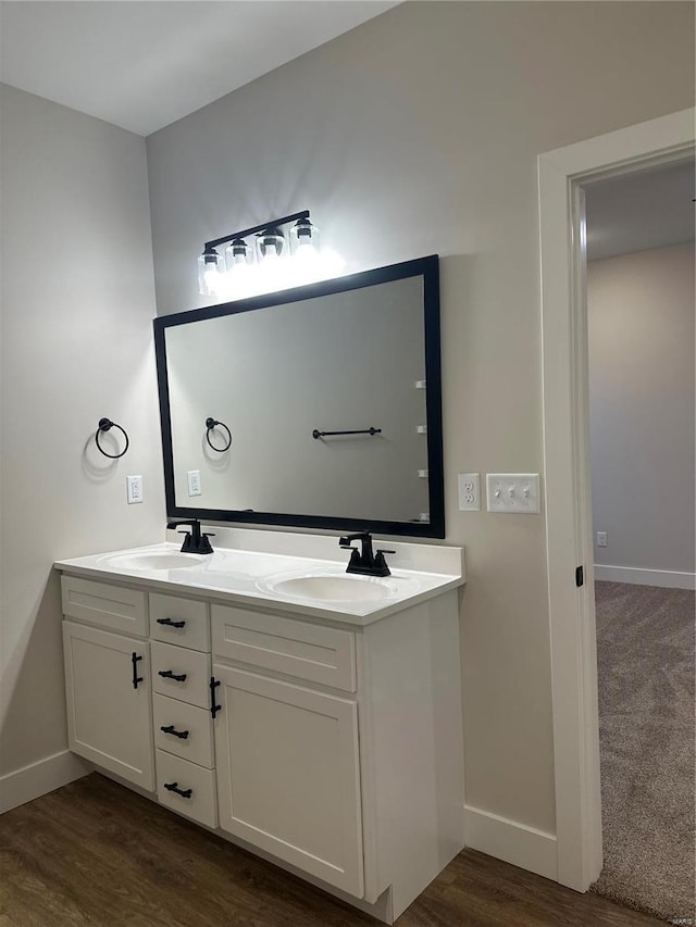 bathroom featuring vanity and wood-type flooring