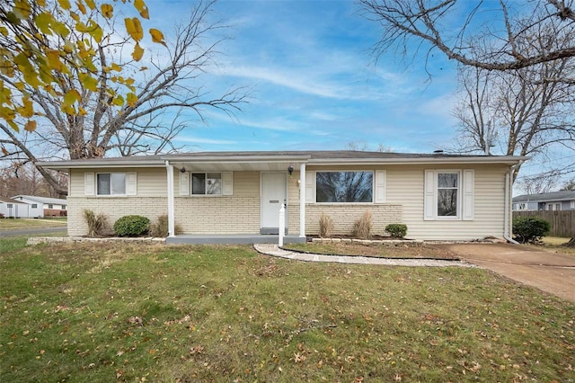 ranch-style home with a front lawn