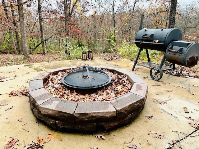 view of patio with an outdoor fire pit