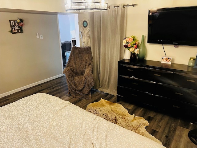 bedroom featuring dark hardwood / wood-style floors