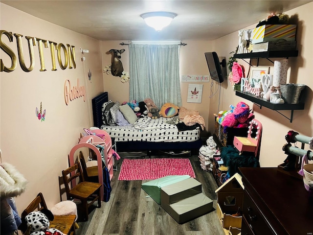 bedroom featuring hardwood / wood-style flooring