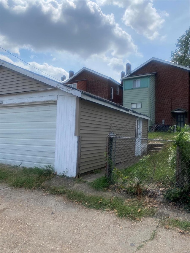 view of side of home with a garage