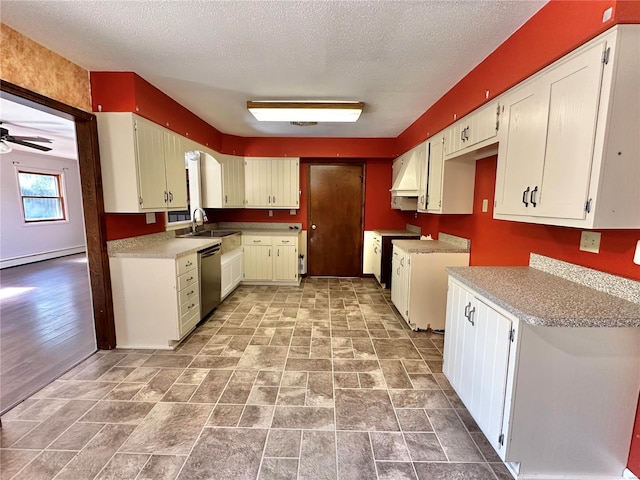 kitchen with sink, stainless steel dishwasher, ceiling fan, a textured ceiling, and a baseboard radiator