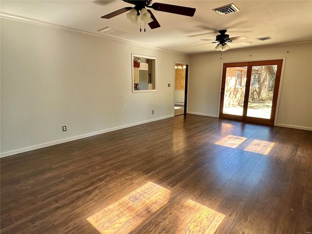 spare room with ceiling fan, dark hardwood / wood-style flooring, and ornamental molding