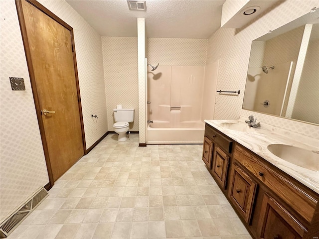 full bathroom with vanity, shower / bathing tub combination, a textured ceiling, and toilet