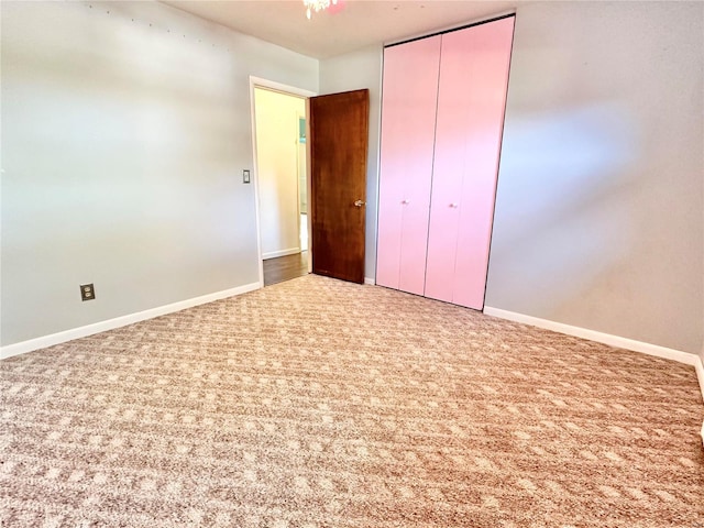 unfurnished bedroom with carpet floors and a closet