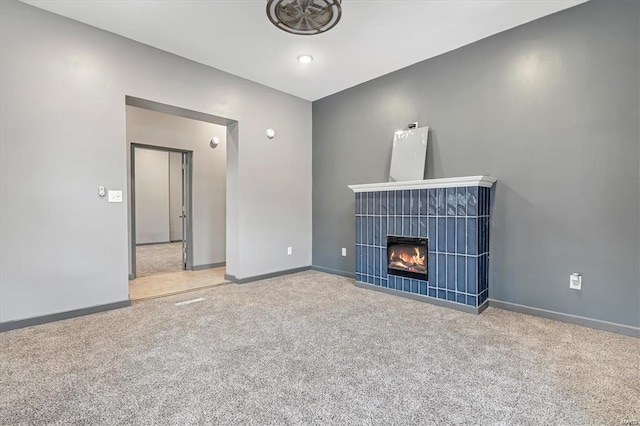 unfurnished living room featuring carpet flooring