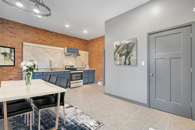 dining area featuring brick wall