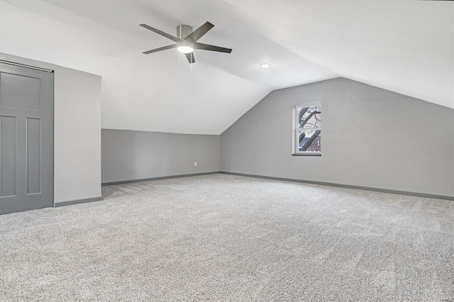 bonus room with ceiling fan, vaulted ceiling, and carpet