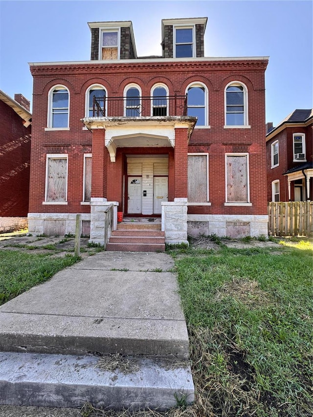 view of front of house featuring a balcony