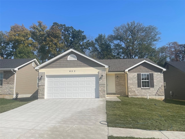 single story home featuring a garage and a front lawn