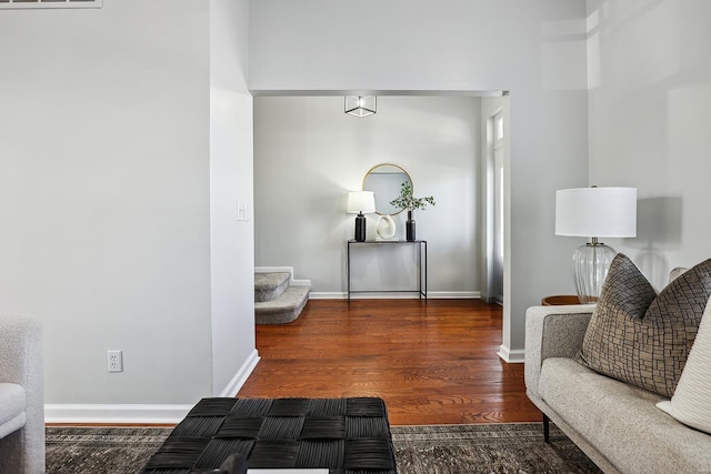 sitting room featuring dark hardwood / wood-style floors