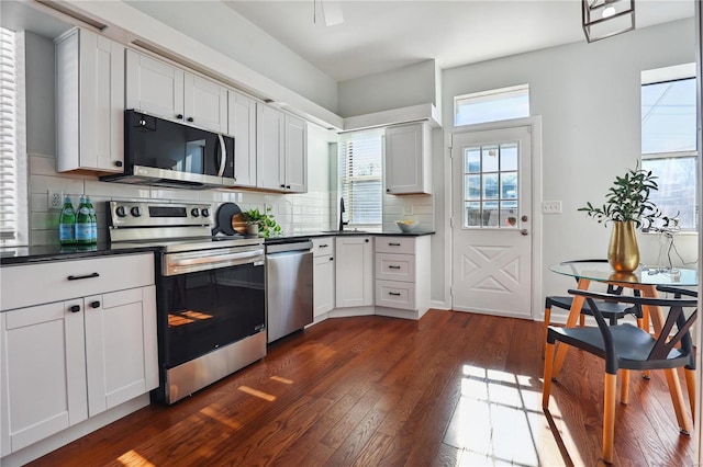 kitchen with white cabinetry, sink, appliances with stainless steel finishes, and tasteful backsplash