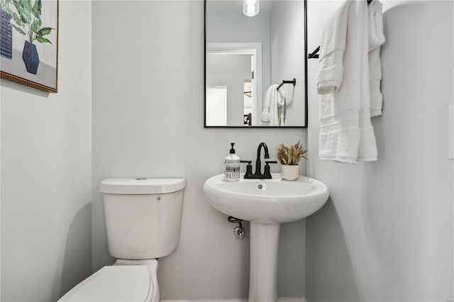 bathroom with sink and toilet