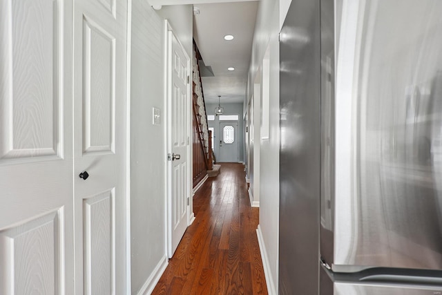 hallway featuring dark hardwood / wood-style flooring