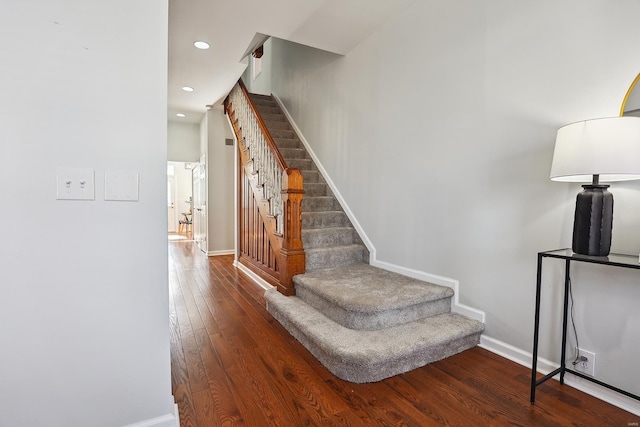 stairway with wood-type flooring