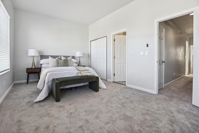 bedroom featuring light carpet and a closet