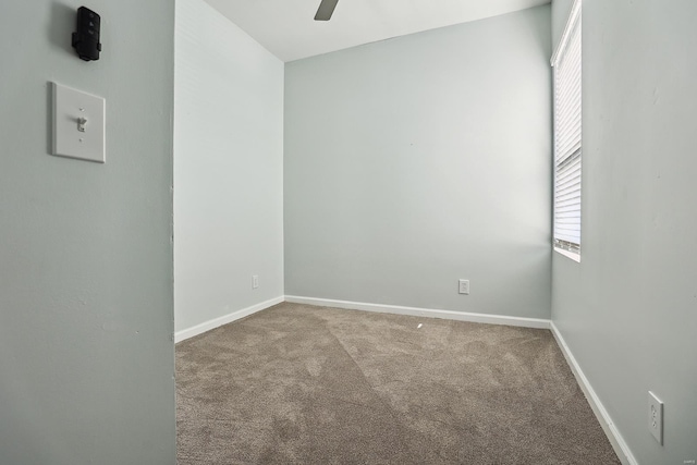 carpeted empty room with ceiling fan