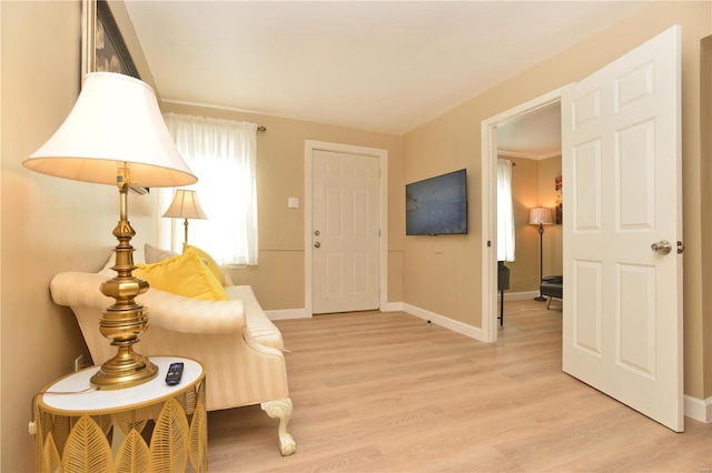 sitting room with light hardwood / wood-style floors