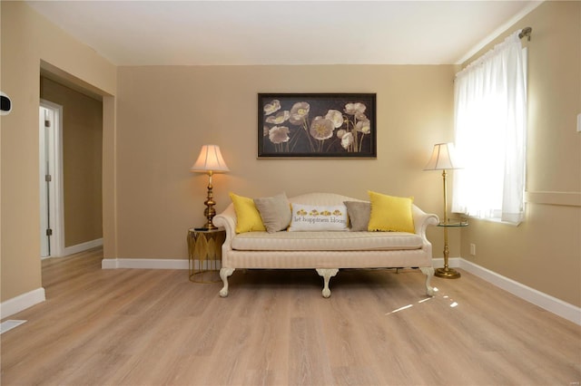 sitting room with light hardwood / wood-style flooring