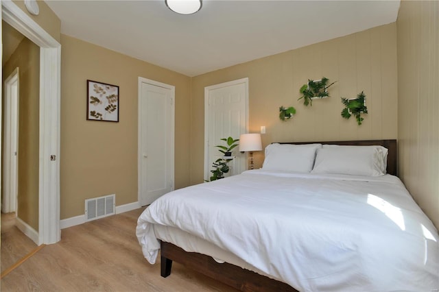 bedroom with light hardwood / wood-style floors