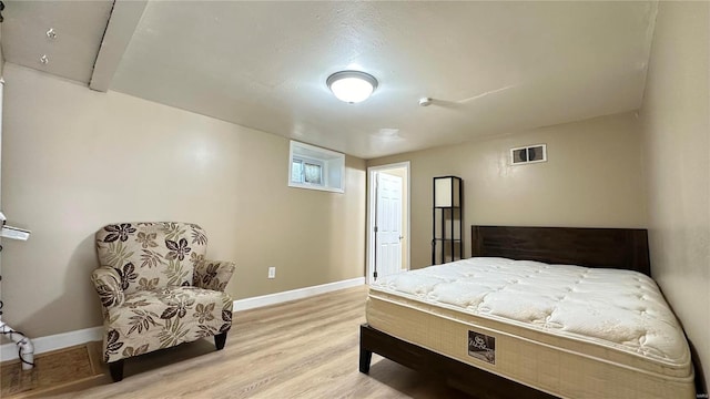 bedroom with light hardwood / wood-style flooring