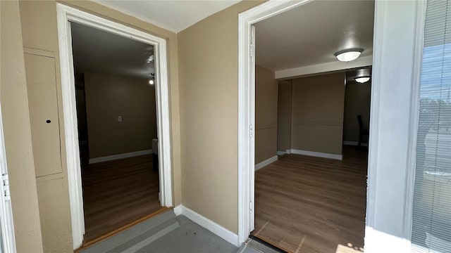 corridor featuring hardwood / wood-style flooring