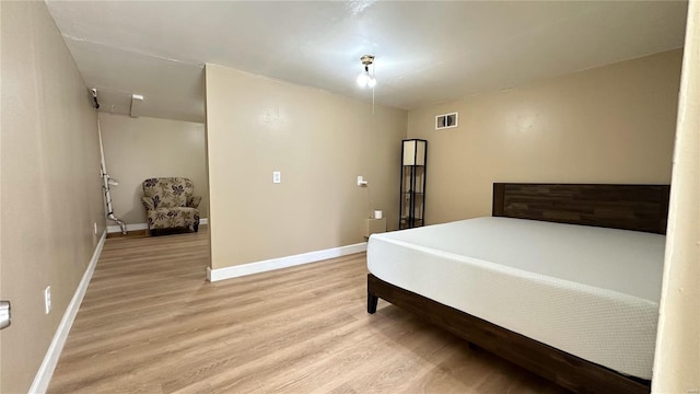 bedroom featuring light hardwood / wood-style flooring