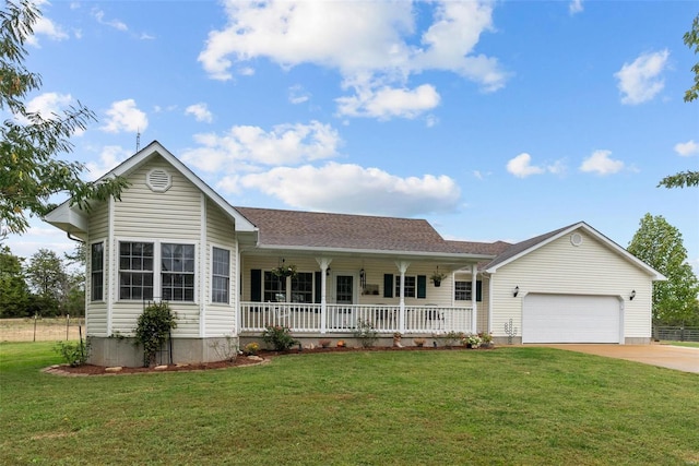 ranch-style home with a garage, a front yard, and covered porch