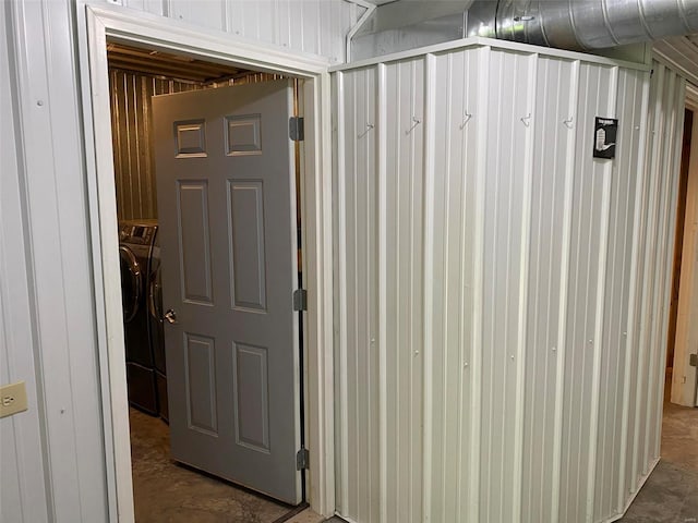 corridor with washer and clothes dryer