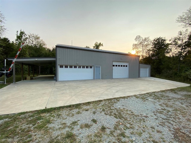 view of garage at dusk