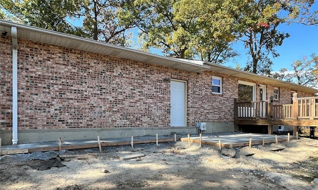 back of house with a wooden deck