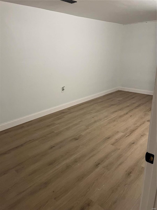 empty room featuring dark hardwood / wood-style floors