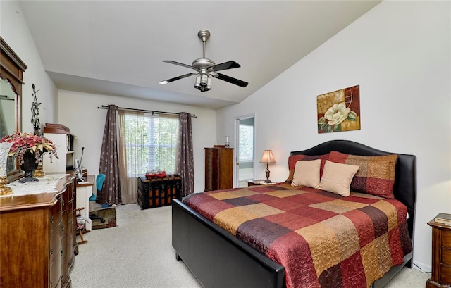 carpeted bedroom with vaulted ceiling and ceiling fan