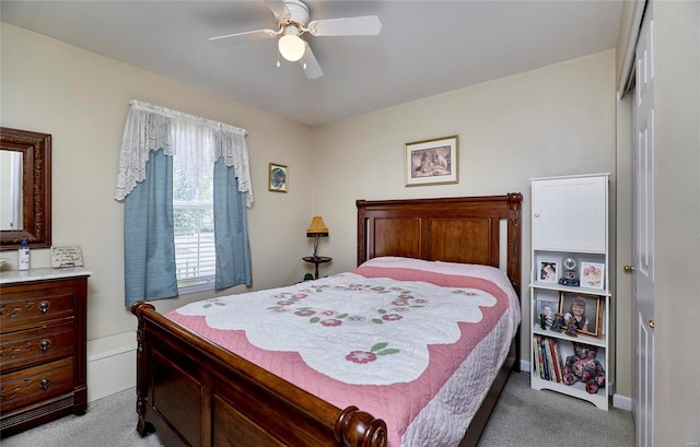 carpeted bedroom with a closet and ceiling fan