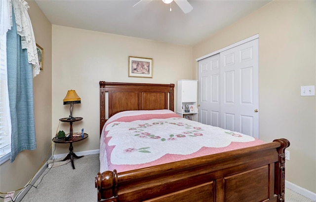 carpeted bedroom featuring a closet and ceiling fan