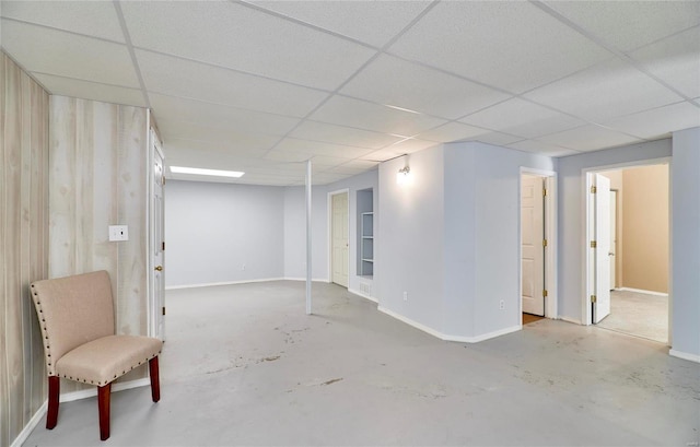 basement featuring a drop ceiling