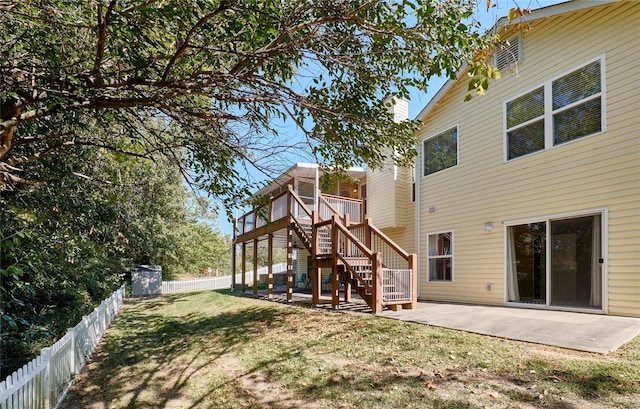 back of house featuring a yard and a patio