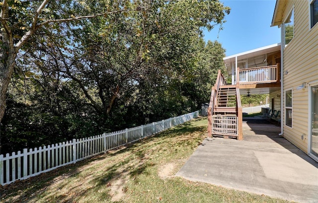 view of yard featuring a patio and a deck