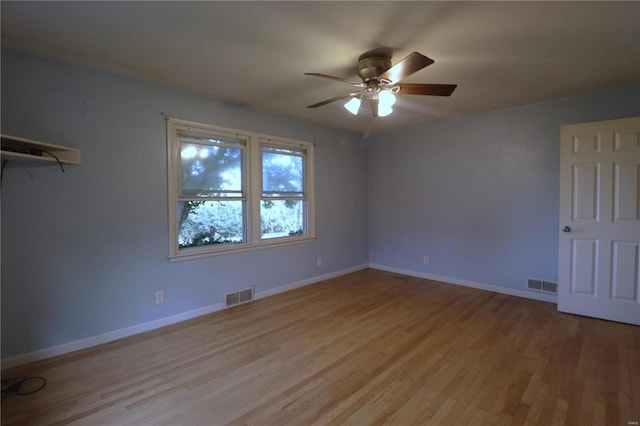 spare room with light hardwood / wood-style flooring and ceiling fan