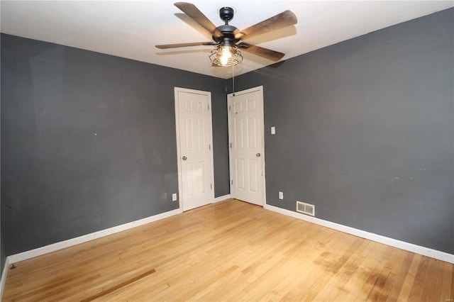 spare room featuring ceiling fan and light hardwood / wood-style flooring