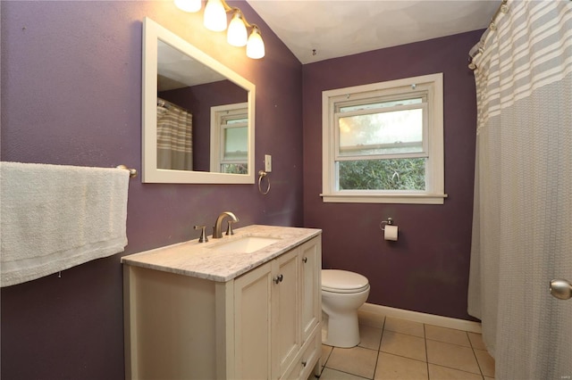 bathroom featuring vanity, toilet, and tile patterned floors