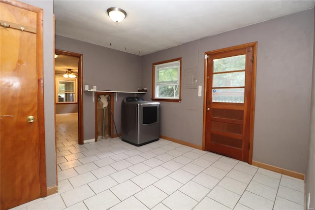 washroom with washer / clothes dryer and light tile patterned floors