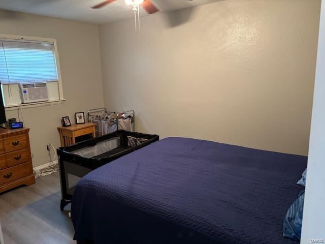 bedroom featuring ceiling fan and hardwood / wood-style floors