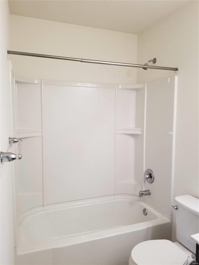 bathroom with toilet and shower / bath combination