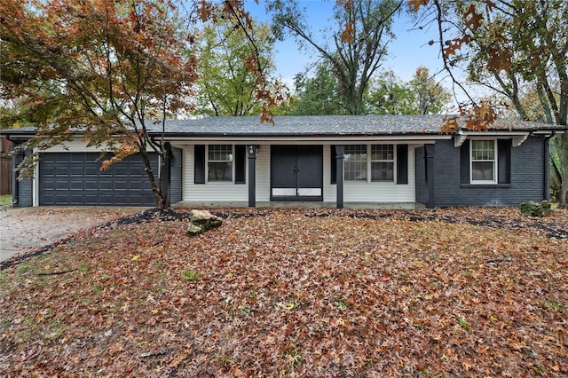 ranch-style home featuring a garage and a porch