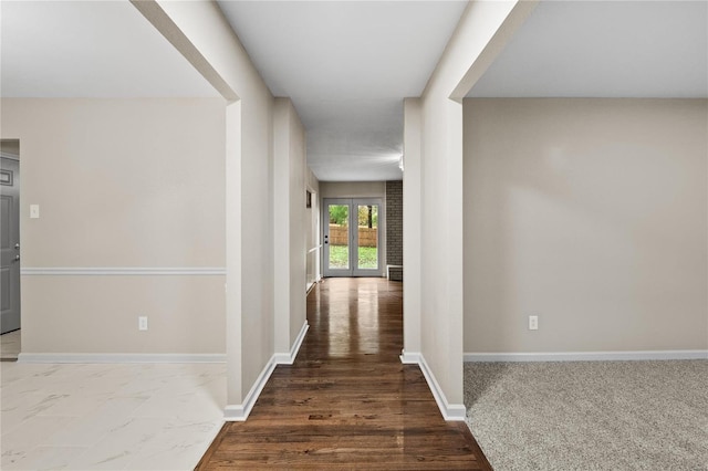 hall with dark hardwood / wood-style flooring