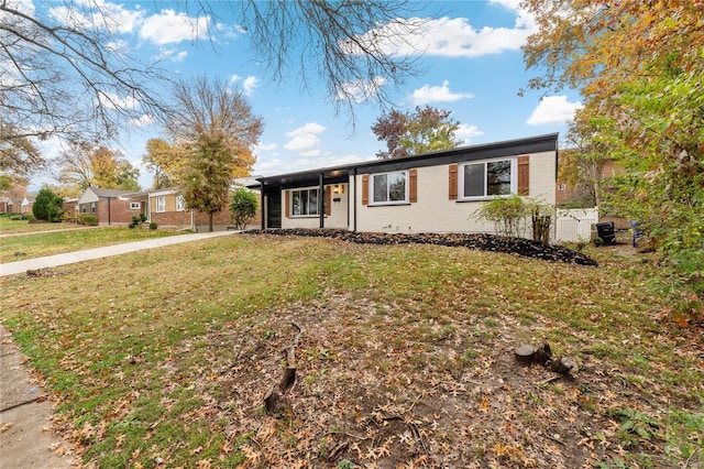 ranch-style home with a front yard